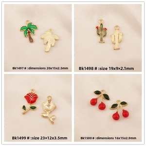 Detail of DIY alloy enamel pendants featuring coconut tree cactus rose and cherry designs
