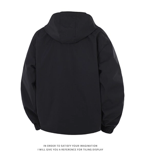 Back view of a black hooded windbreaker jacket with elastic cuffs and windproof fabric