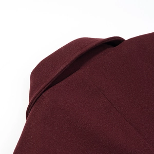 Close-up of deep wine red wool blend lapel showing premium sewing and fabric texture