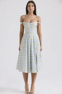 Detail of floral midi dress featuring boned corset waist and side slit in light blue