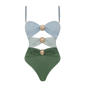 Detail of hollow-out swimsuit with gold sphere buckles and three-tone color block design