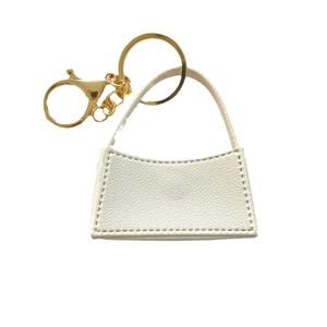 Portachiavi in pelle bianca con trama litchi e anello in metallo dorato lucido