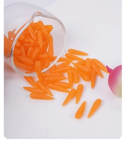 Close-up of 1.8cm miniature resin carrots for dollhouse kitchen and DIY craft scenes