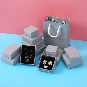 Gray litchi grain jewelry boxes and paper gift bag with necklace display