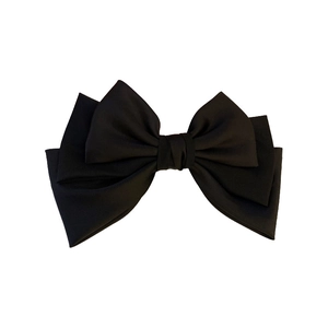 Elegant black layered fabric bow hair clip with minimalist French luxury spring design
