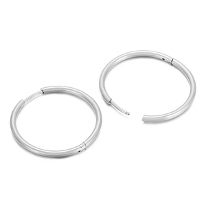 Polished silver stainless steel hoop earrings for women on a white background