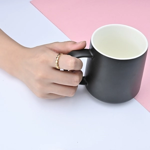 Close-up of golden stackable star ring on model hand with elegant lifestyle vibe