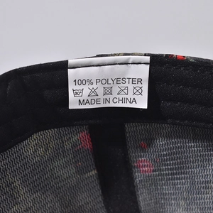 Detailed macro view of internal care label showing 100% polyester fabric and washing symbols
