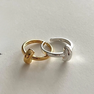 Minimalist 925 sterling silver knot rings in gold and silver finishes with adjustable band