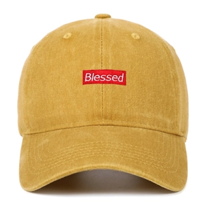 Detailed view of Blessed embroidery on yellow washed cotton vintage baseball cap
