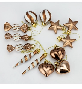 Detailed view of 13-piece copper Christmas tree ornaments with white glitter and gold strings