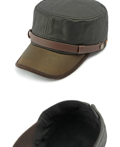 Detail view of cotton cadet cap showing brown faux leather brim and interior material label