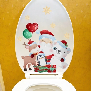 Close-up of Santa and Reindeer adhesive toilet lid decals with gold snowflakes