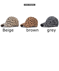 Three leopard print baseball caps in beige, brown, and grey shown in a row