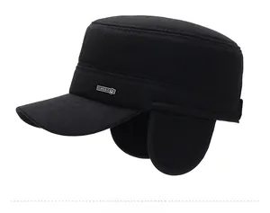 Side view of winter wool flat cap featuring fold-out ear flaps and metal logo detail