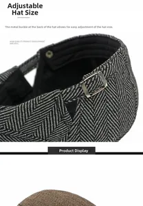 Detail of adjustable silver metal buckle on classic herringbone pattern flat cap