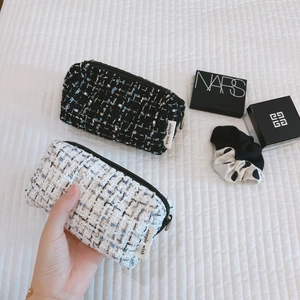 Mini tweed cosmetic bags in black and white with simple wish labels and zipper closure