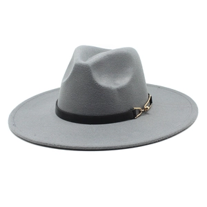 Detail of grey wool fedora hat with black leather strap and gold buckle accent
