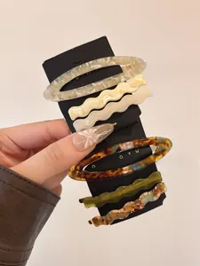 Set of 6 acetate hair clips featuring tortoiseshell patterns and wavy colorful designs
