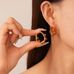 Vintage flower hoop earrings with orange rose relief and sparkling crystal accents