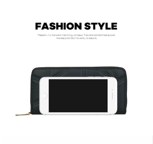 Detail of black V-quilted long wallet with gold zipper and smartphone size reference