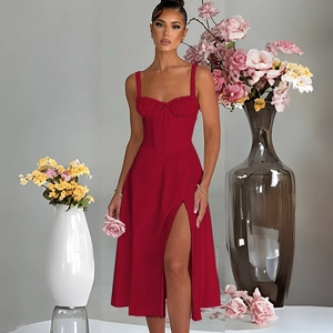 Detail of red slim-fit dress featuring ruched chest design and thigh-high side slit