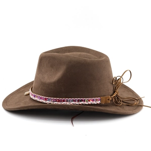 Detailed view of the brown wide-brim cowboy hat with colorful braided band and leather tassels