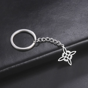 Detail shot of Celtic knot stainless steel pendant on a dark leather surface