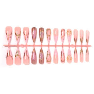 3D almond press-on nails with pink base, gold drip texture, pearls, and star accents