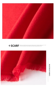 Macro shot of high-quality red scarf showing soft fabric texture and frayed edge detail
