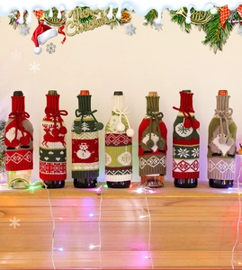 Detailed knit Christmas wine bottle covers featuring festive patterns and pom-poms decor