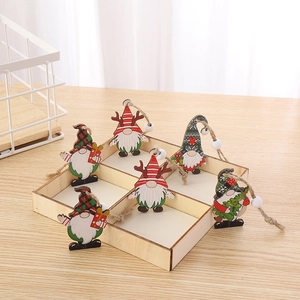 Set of six colorful wooden Christmas gnomes in a wooden storage box with hemp ropes