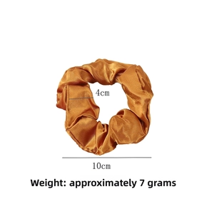Detail showing 10cm outer diameter and 4cm inner diameter of the satin silk scrunchie