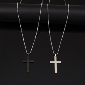 Titanium steel cross necklaces in black and silver finishes on a box chain for men