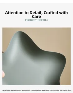Macro view of star-shaped iron dessert tray showing matte finish and smooth rolled edges
