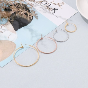 Minimalist large hoop earrings in gold, rose gold, and silver finishes with various sizes