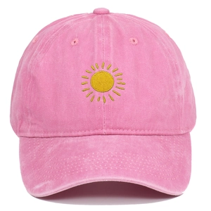 Pink washed cotton baseball cap with yellow sun embroidery in a retro vintage style