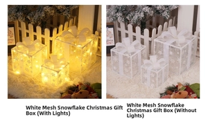 Close-up of lighted and unlighted mesh Christmas gift boxes with warm LED snowflakes