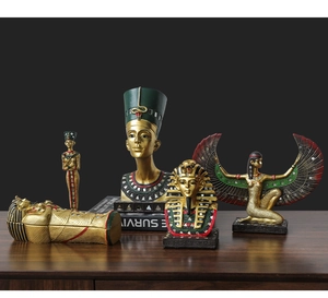 Detailed set of Egyptian resin figurines including Nefertiti bust and golden sarcophagus