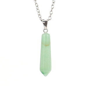 Detail of light green hexagonal crystal pendant with a silver-colored metal chain