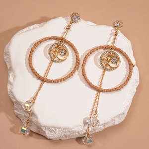 Bohemian gold tassel drop earrings with moon star charms and brown woven circles