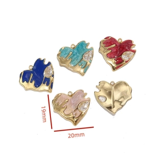 Macro shot of colorful enamel heart pendants with dimensions 20mm by 19mm and crystal accents