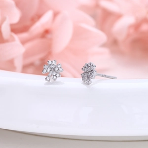 Macro shot of S925 sterling silver four-leaf clover stud earrings with pavé zircon stones
