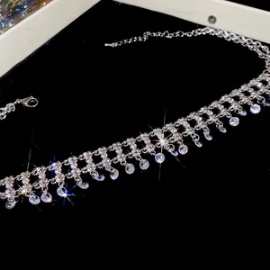 Elegant silver-toned choker necklace featuring sparkling zircon tassels on a velvet background