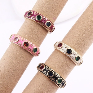 Retro bohemian gold plated rings with colorful enamel and zircon stones on display