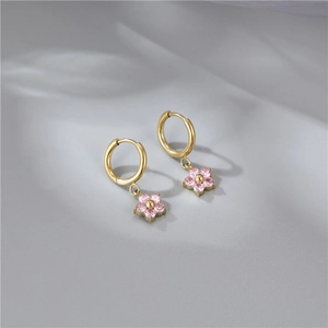 Elegant gold flower hoop earrings with pink rhinestones and a sweet minimalist floral design