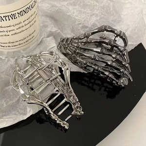 Gothic skull hand metal hair claws set in silver and dark grey for elegant styling