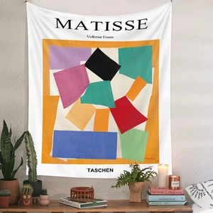 Detail of Matisse style bohemian wall tapestry in a cozy modern home interior setting