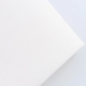 Close-up of white breathable woven fabric with fine mesh texture for a two-piece set