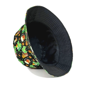 St. Patrick's Day bucket hat with green clover and beer mug prints on black fabric
